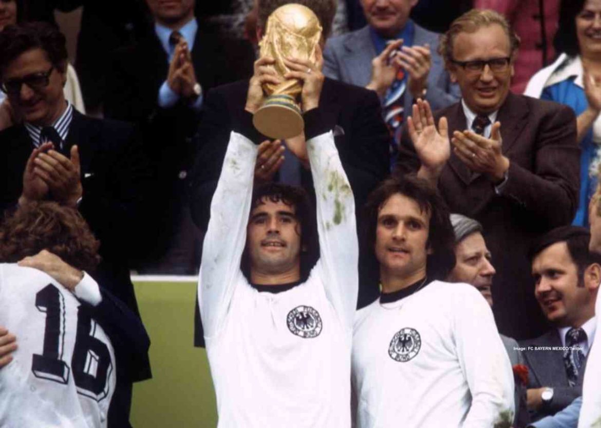  West Germany captain Franz Beckenbauer holds the trophy aloft after his team's victory in the 1972 European Championship final.